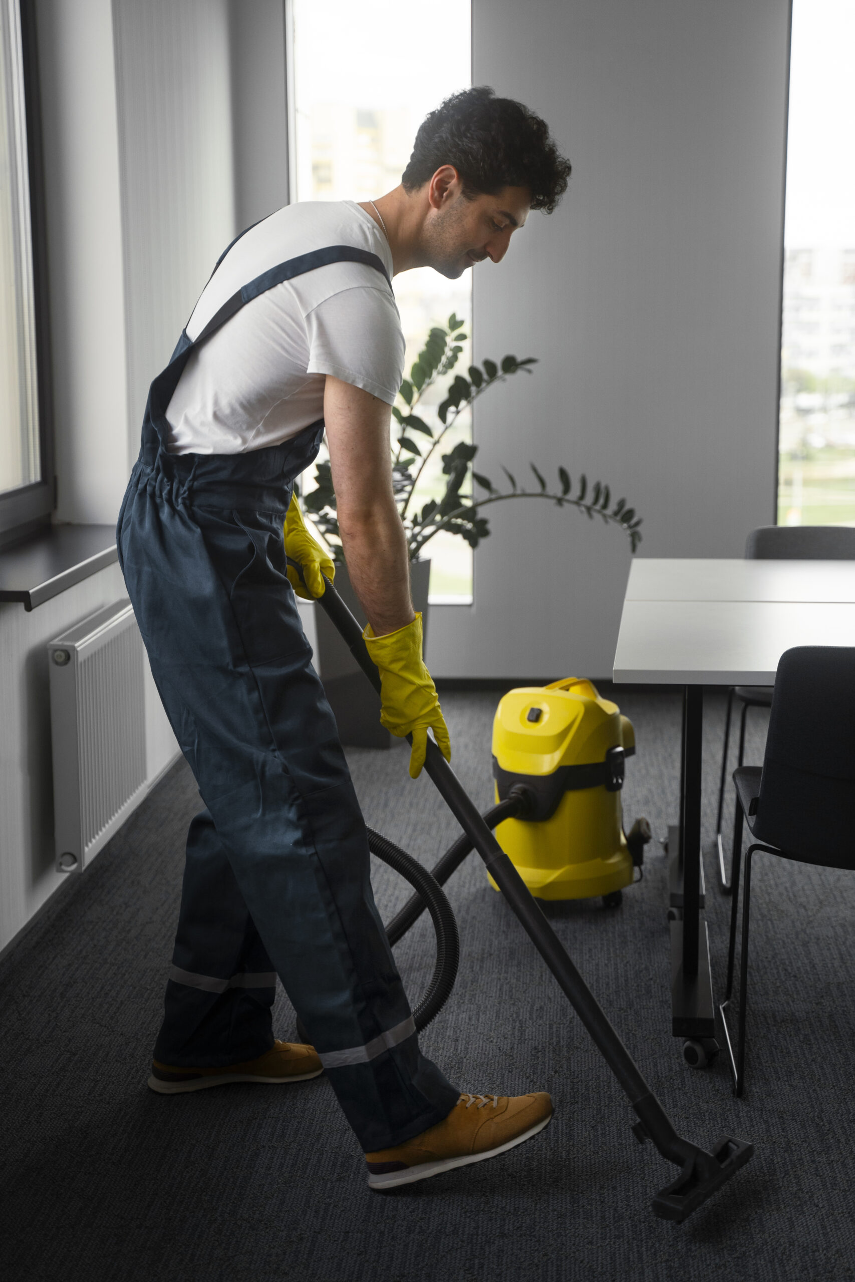 Home full shot man cleaning indoors